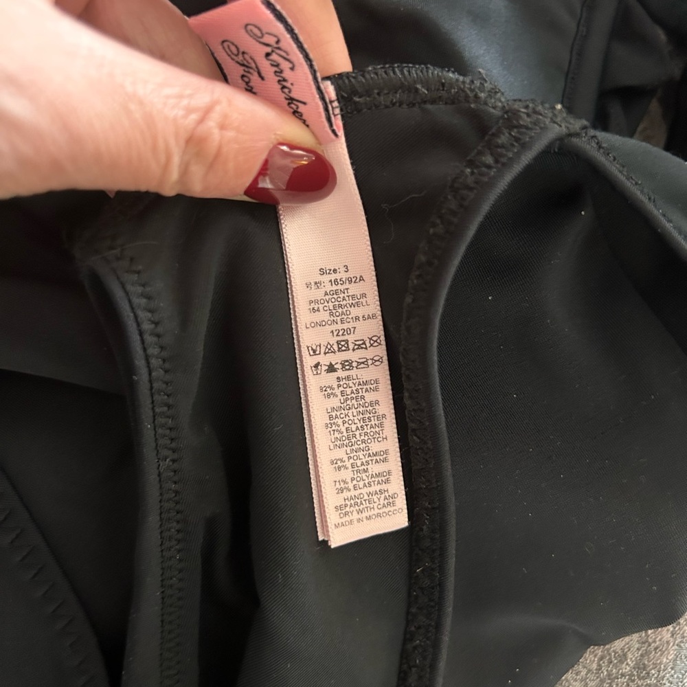 Never worn agent one piece bathing suit. New, but removed tag